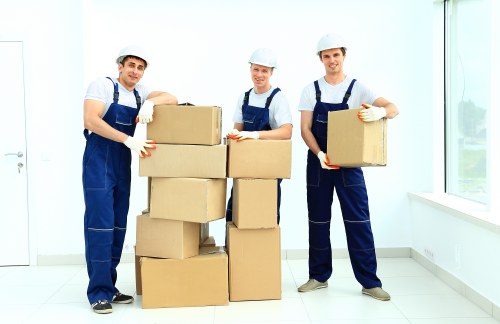 Removal team preparing a Kensington home move with boxes and furniture