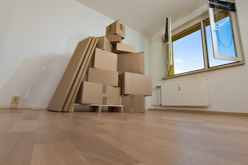 Removal team protecting furniture during a house relocation
