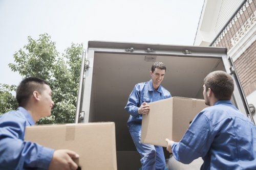 Loading household items into a removal van in Kensington