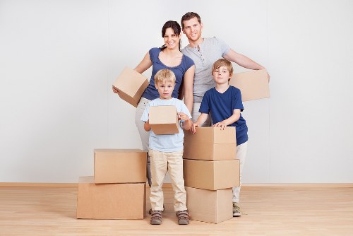 Moving team using protective handling practices during a Kensington van move