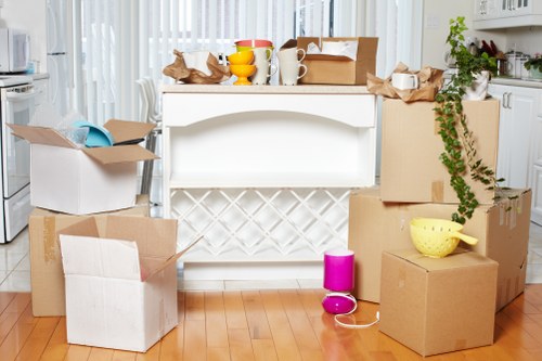 Packed boxes and furniture prepared for a Kensington home or office removal