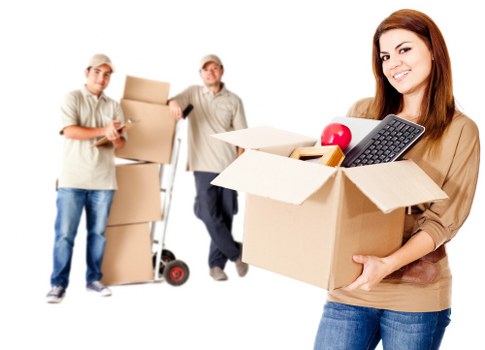 Professional movers handling packed boxes in Kensington