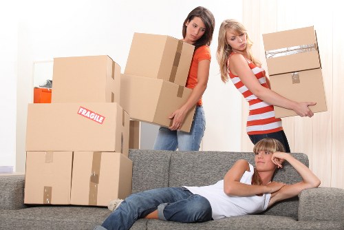 Careful moving of furniture through a narrow indoor space